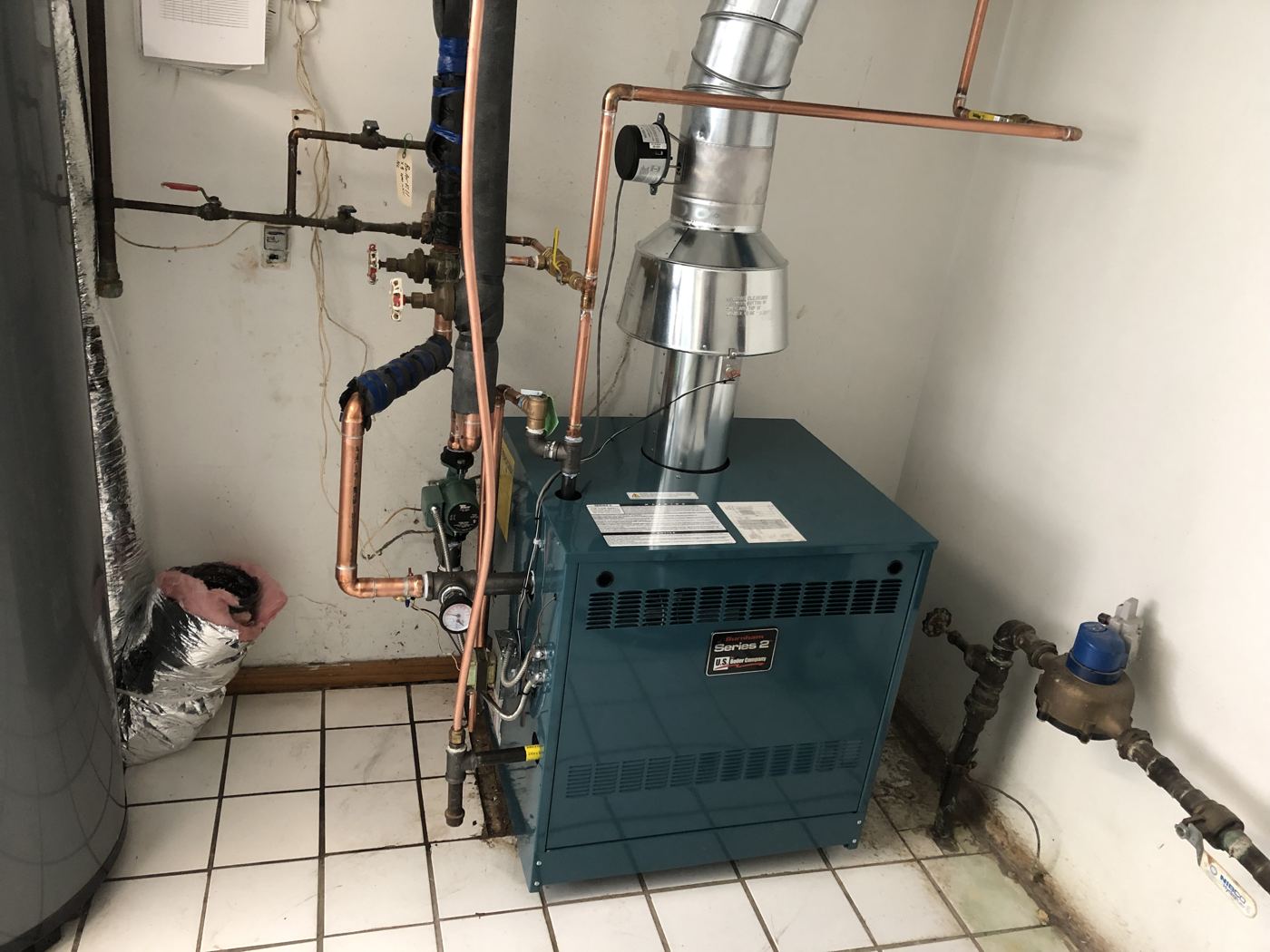 Boiler installed by Anderson Burner in a tiled utility room